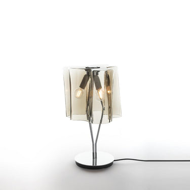 Modern table lamp with smoked glass shade on a white background