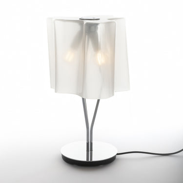 Elegant bedside lamp: Logico Mini by Artemide, ambient light for tranquil bedrooms.