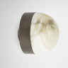 Lucid wall light with bronze band and honed alabaster dome, side view