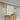 Lucivagus Wall Sconce Casting Warm Ambient Light in a Living Room