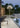 Oluce Lyndon 351 outdoor floor lamp on a poolside terrace at dusk