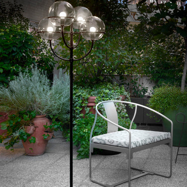 Oluce Lyndon 351 outdoor floor lamp in a garden at night