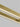 Close-up of natural brass finish on Stagger 84 linear suspension lighting.