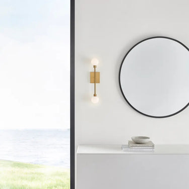 Contemporary Aged Brass Vanity Sconce with Two Globe Lights – Visual Comfort Mara Fixture