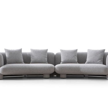 Medium grey boucle curved sofa Marin by Soho Concept in a modern living room setting