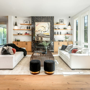 ET2 Mermaid black cone pendants in a living and dining room with white sofas facing each other and tall windows