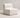 Zig armless chair in a cream textured vinyl, shown in a minimalist lounge setting