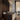 Ilo horizontal pendant above a dark reception counter in a showroom
