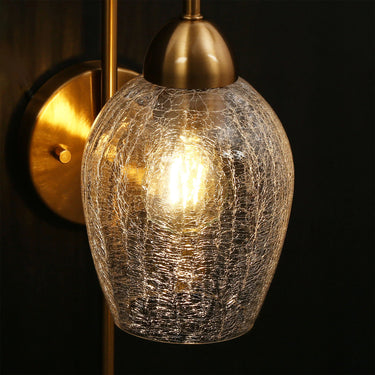 Handcrafted glass wall sconce with brass finish