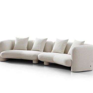 Off white boucle fabric curved sofa Marin by Soho Concept in a contemporary living room
