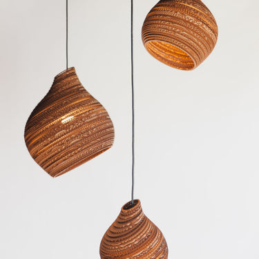 Graypants Hive hanging lamp in blonde finish made from sustainable materials - three lights intalled