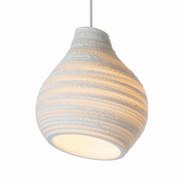 Modern dining room featuring Graypants Hive pendant light providing warm ambient light, white finish