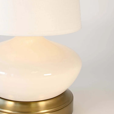 Bella cordless table lamp with ivory ceramic body and brass accents