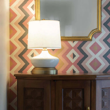 Modern cordless table lamp with ivory ceramic finish and brass hardware