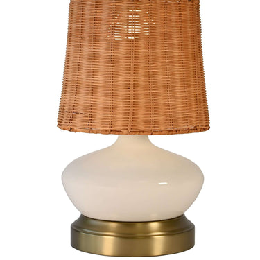 Cordless ivory ceramic table lamp with antique brass base and woven rattan shade