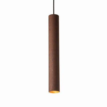 Linear arrangement of three rust finish Roest pendants above dining table