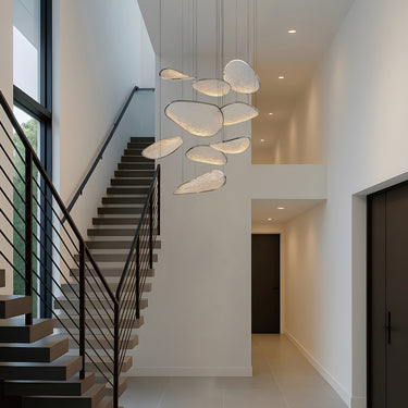 ET2 Moonscapes textured glass panels hanging through a stairwell beside a black stair railing