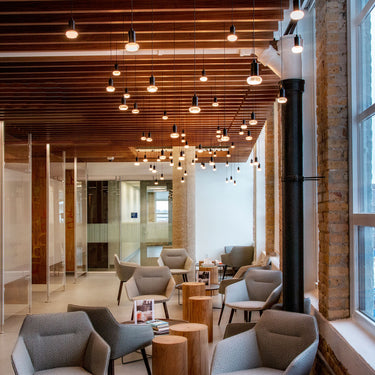 Blackjack Lighting LED pendant with frosted mushroom impression diffuser in a fine dining setting, multiple lights installed