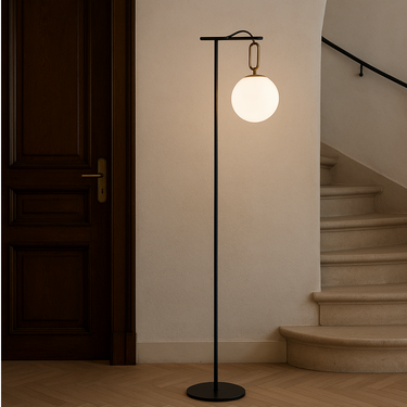 Designer NH floor lamp by Artemide featuring black metal pole and round glass shade for hotel reception areas