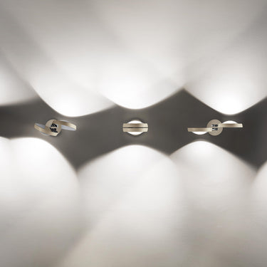 Designer Nautilus LED Wall Lamp by Lodes with adjustable 2200K–2700K dim-to-warm lighting for ambient illumination