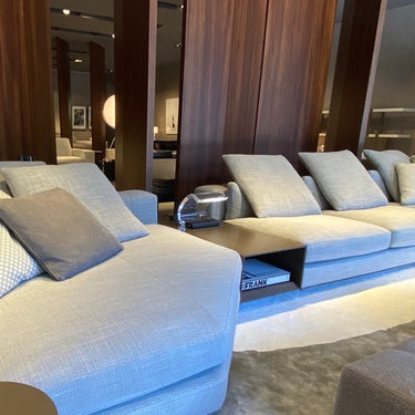 Acrilica table lamp beside a cream sofa in a living room
