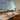 Row of Agnoli table lamps on a long table by a window
