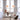 Two Oluce Alba 465 pendant lights with glass spheres hanging in a room