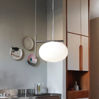Oluce Alba 466 pendant light hanging in a styled room