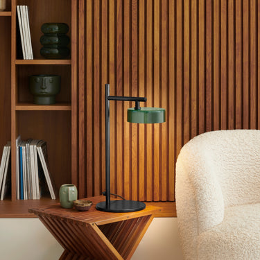 Oluce Berlin-Out table lamp on a side table in a library corner