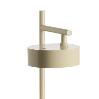 Close view of the round head and stem of the ivory Berlin-Out table lamp