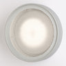 Oluce Berlin-Out round wall lamp in matt aluminium with a textured acrylic disc on a white background