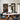 Oluce Berlin matt black pendant over a round dining table