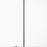Oluce Berlin-Out outdoor floor lamp with a green round head and black stem on a light studio floor