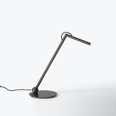 Oluce Calamaio satin black nickel desk lamp, studio view on white