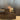 Oluce The Globe table lamp glowing on a dark wooden console