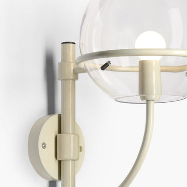 Lyndon 161 mini outdoor wall lamp by Oluce in ivory, closeup studio shot