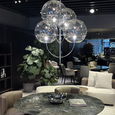 Lyndon pendant light by Oluce over a dining table, lifestyle view