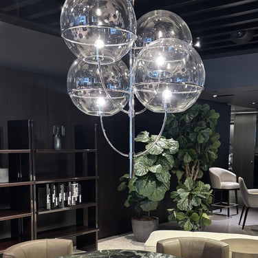 Lyndon pendant light by Oluce over a dining table, lifestyle view