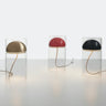 Three Oluce Medusa table lamps in lacquered black with glass cylinders on a white studio background