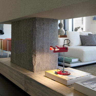 Oluce Mini Spider table lamp as a bright accent in a living space