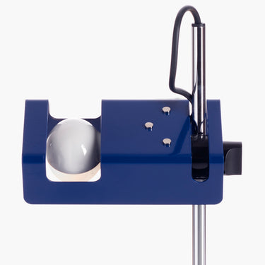 Close detail of the blue Oluce Mini Spider reflector and stem
