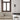 Oluce Pascal floor lamp beside a cream sofa in a room with tall windows