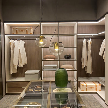 Oluce The Globe pendants hanging in a walk-in wardrobe
