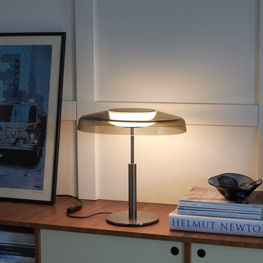 Oluce Dora table lamp on a side table, lifestyle view