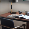 1953 Table Lamp by Oluce in satin gold stem and matte black shade for modern interiors