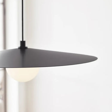 Visual Comfort Pirlo pendant showing downward light from disc shade