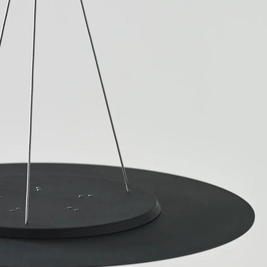 Sleek black LED disc pendant light by Visual Comfort for dining rooms, kitchens, and commercial spaces