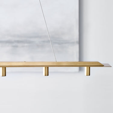 Ponte 50 modular linear suspension glowing in a designer interior