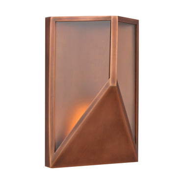 The Punto 10 copper wall light mounted on an exterior patio wall, illustrating its durability and clean, modern form.