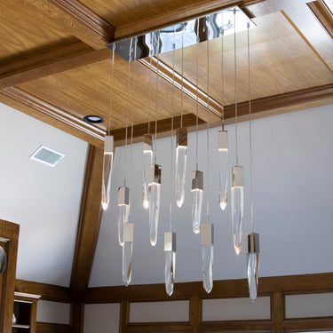 ET2 Quartz crystal pendant cluster seen against wood beams and a skylight in a vaulted living room